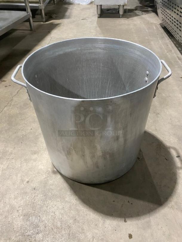 Commercial heavy-duty round stock pot with handles, large capacity, used condition, ideal for restaurant kitchens.