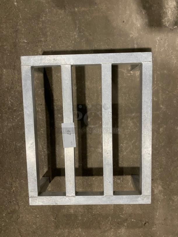 Commercial heavy-duty dunnage rack on legs, metal construction, showing tag with number 47, used for storage and organization.