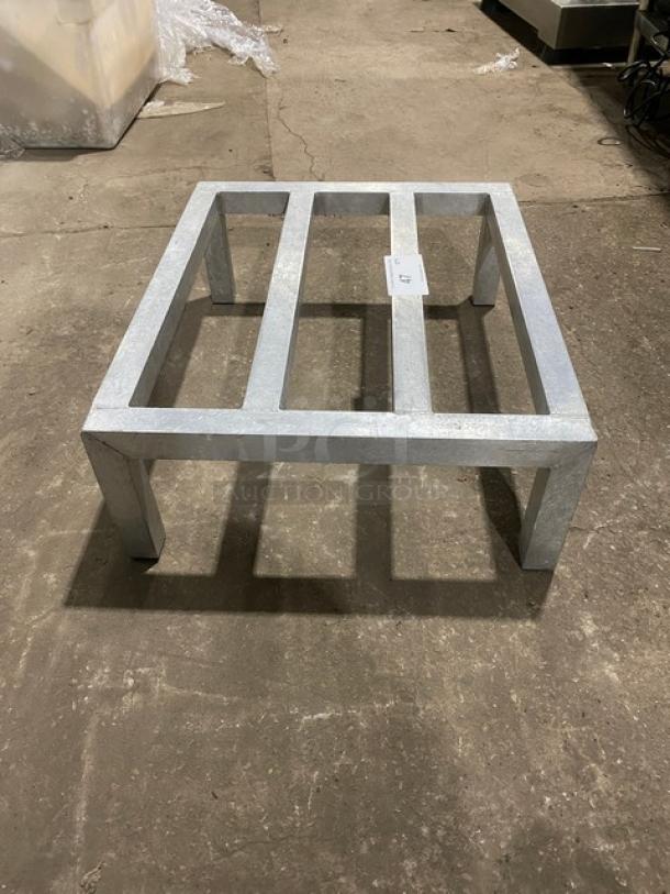 Commercial heavy-duty dunnage rack on legs, metal construction, excellent condition, numbered tag visible. Ideal for storage.