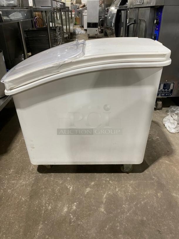 Commercial white portable food ingredient bin with clear lid, on casters. Used condition, ideal for kitchen storage.