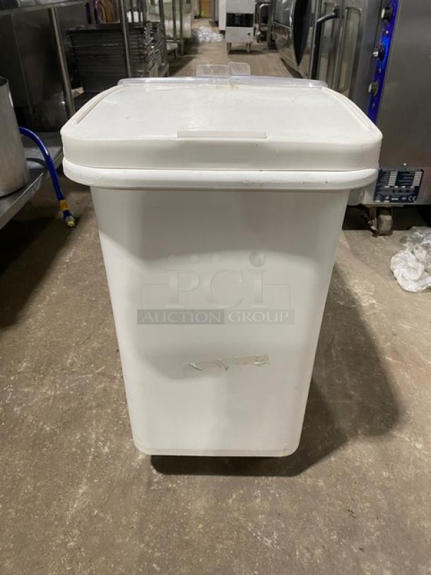 Commercial white portable food ingredient bin with clear lid, on casters. Used condition, ideal for kitchen storage.