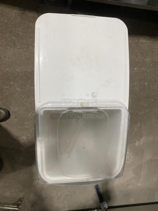 Commercial white portable food ingredient bin with clear lid and casters. Used condition, ideal for kitchen storage.