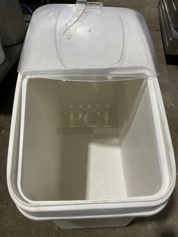 Commercial white portable food ingredient bin with clear lid, on casters, ideal for kitchen storage.