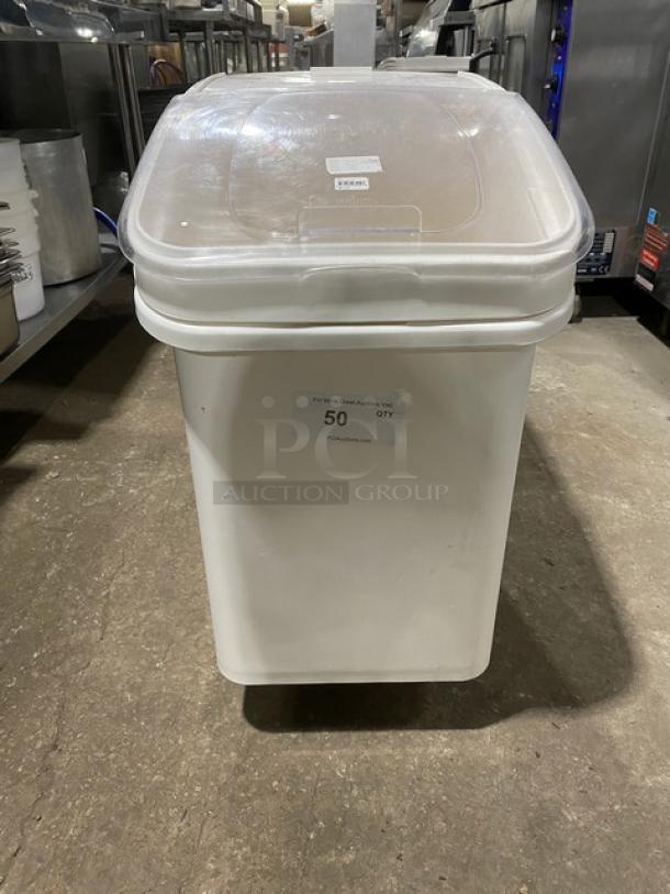 Winco commercial white food ingredient bin with clear lid, on casters. Visible label with quantity "50 QTY." Ideal for storage.