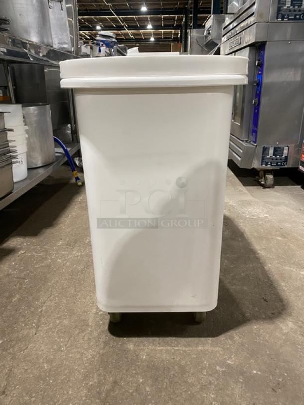 Winco commercial white portable food ingredient bin with clear lid, on casters, excellent condition, ideal for storage.
