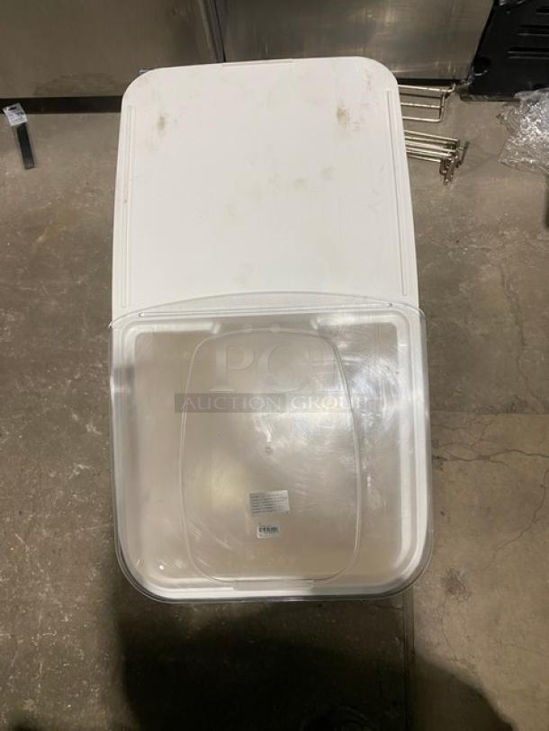 Winco commercial white portable food ingredient bin with clear lid, on casters. Features include sturdy design and mobility.