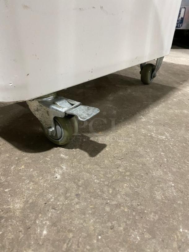 Winco commercial white portable food ingredient bin on casters, features a clear lid, used condition.