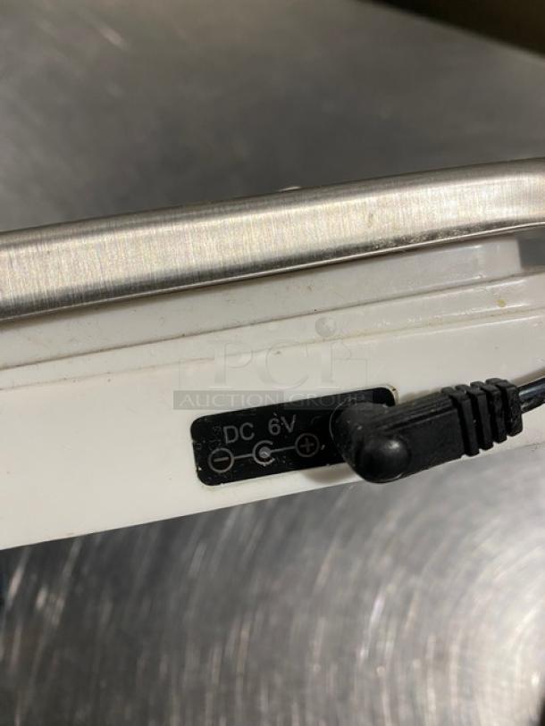 CDN Commercial 22 Lb. Digital Weight Scale, Model SD2206, with DC 6V power input, shown on metallic surface.