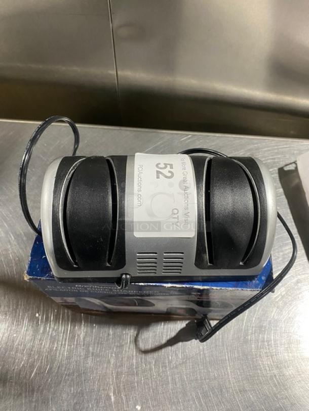 Brentwood TS1001 2-Stage Knife Sharpener, electric-powered, 120V, in good condition, on original packaging, visible power cord.