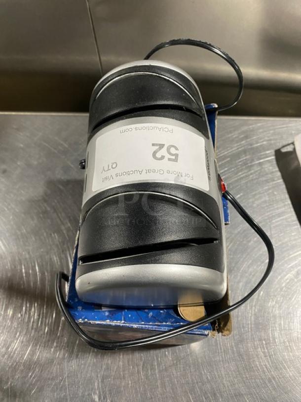 Brentwood TS1001 2-stage electric knife sharpener, 120V, in good condition. Auction label present.