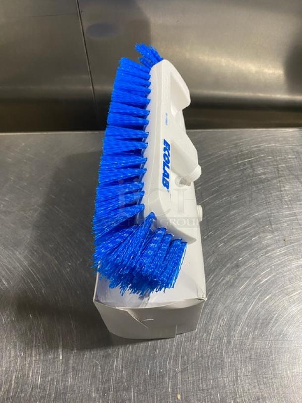 Ecolab commercial dual surface deck brush with blue bristles, new in box. White handle with Ecolab branding visible.