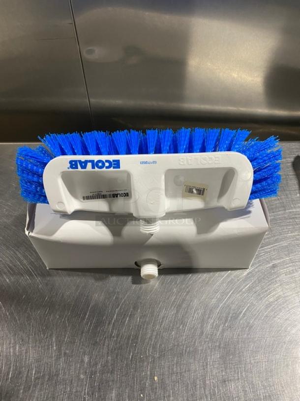 Ecolab white dual surface deck brush with blue bristles, new in box. Brand marking visible on handle.