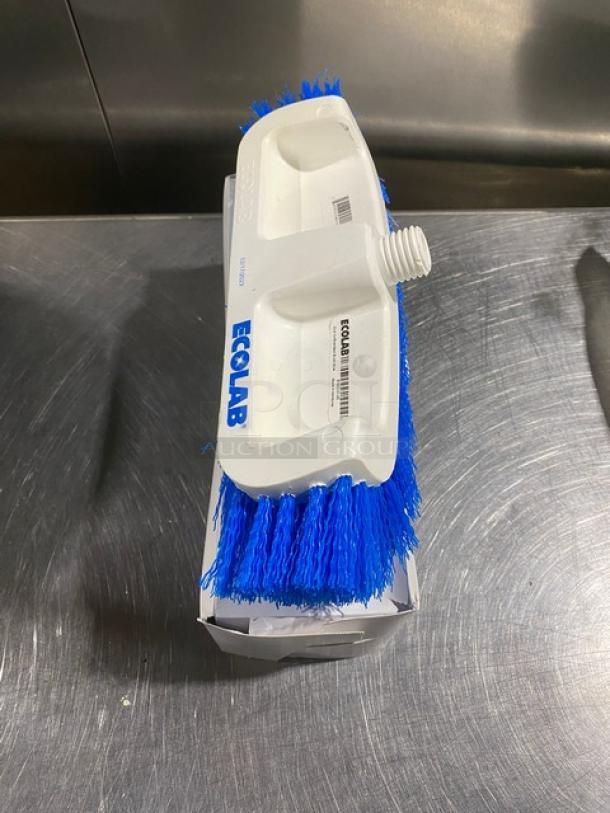 Ecolab commercial dual surface deck brush, white with blue bristles, new in box. Features Ecolab branding and bristle labels.