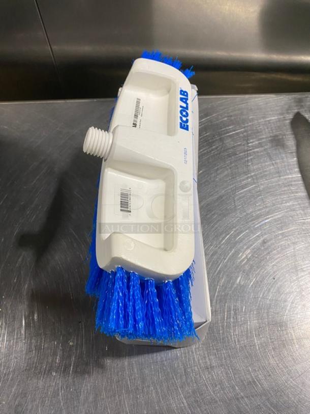 Ecolab commercial dual surface deck brush with blue bristles, white handle, brand-marked, in new condition, in box.