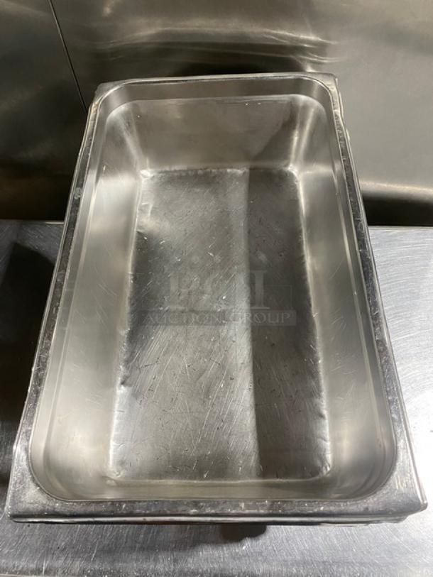 Commercial stainless steel steamtable pan, rectangular, gently used, clean surface, ideal for hotel catering.