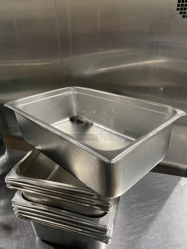 Commercial stainless steel steamtable pan, stack of seven. Used condition. Ideal for hotel or catering use.