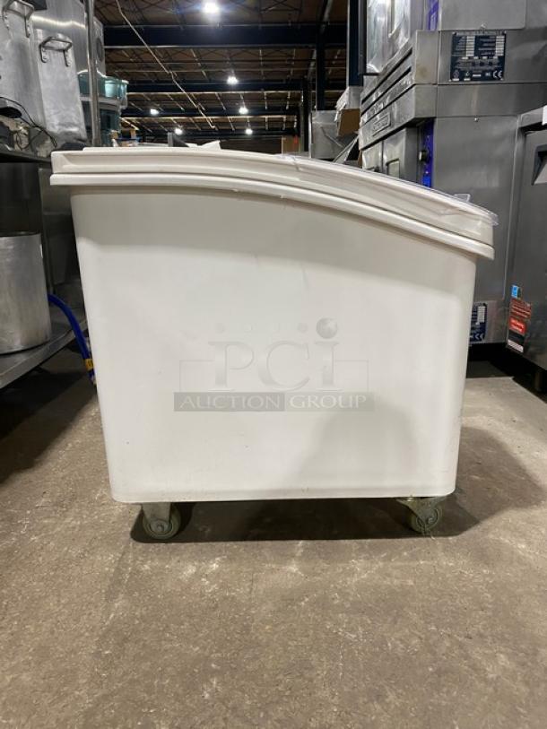 Winco commercial white portable food storage bin with clear lid, on casters. Durable plastic, used condition.