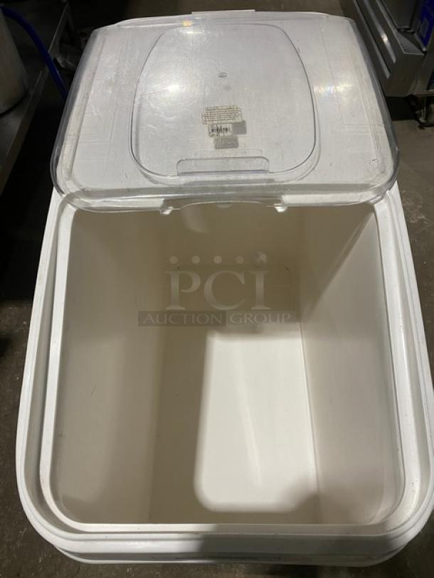 Winco commercial white food storage bin with clear lid, on casters. Spacious interior, durable construction. Ideal for ingredients.
