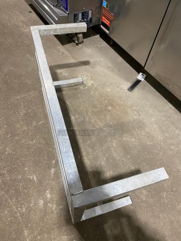 Commercial heavy-duty dunnage rack on legs, metal construction, sturdy, suitable for storage, excellent condition.