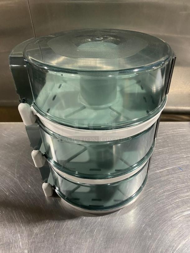 Wisconsin Tissue Smoke Gray Paper-Roll Dispenser; commercial use; durable plastic; excellent condition; stackable design.