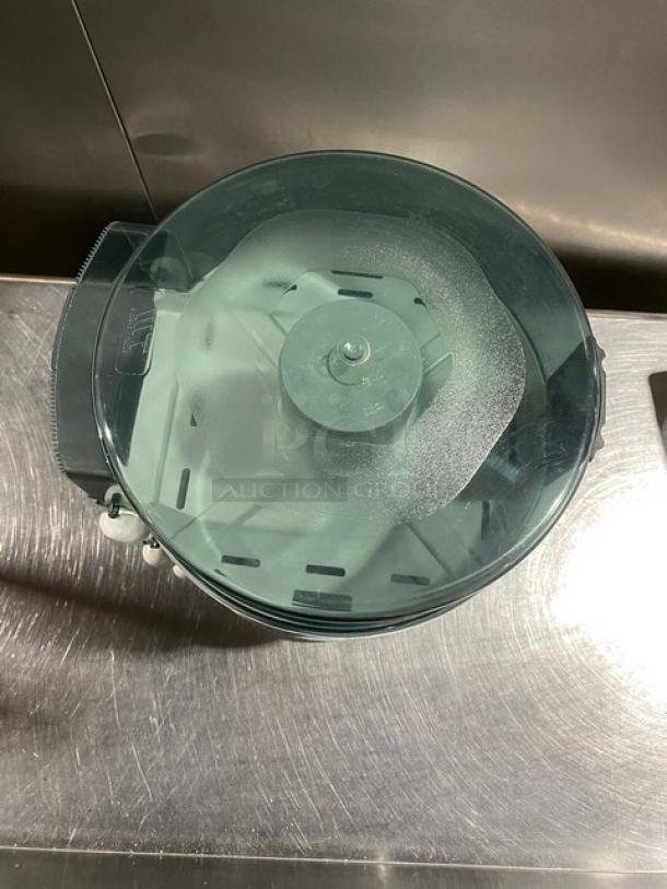 Wisconsin Tissue smoke gray paper-roll dispenser, commercial-grade, excellent condition, top view showing mechanism.