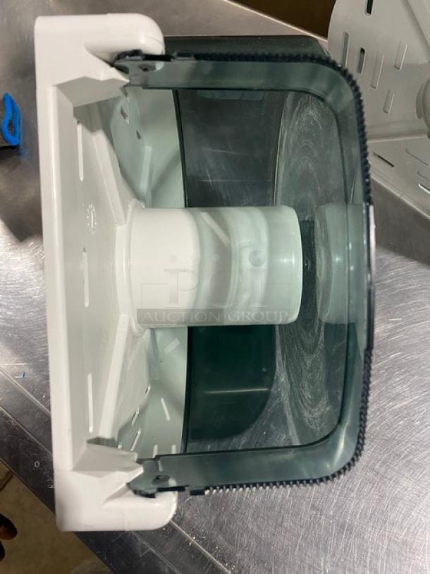 Wisconsin Tissue smoke gray paper-roll tissue dispenser, commercial model. Features durable plastic and sleek design.