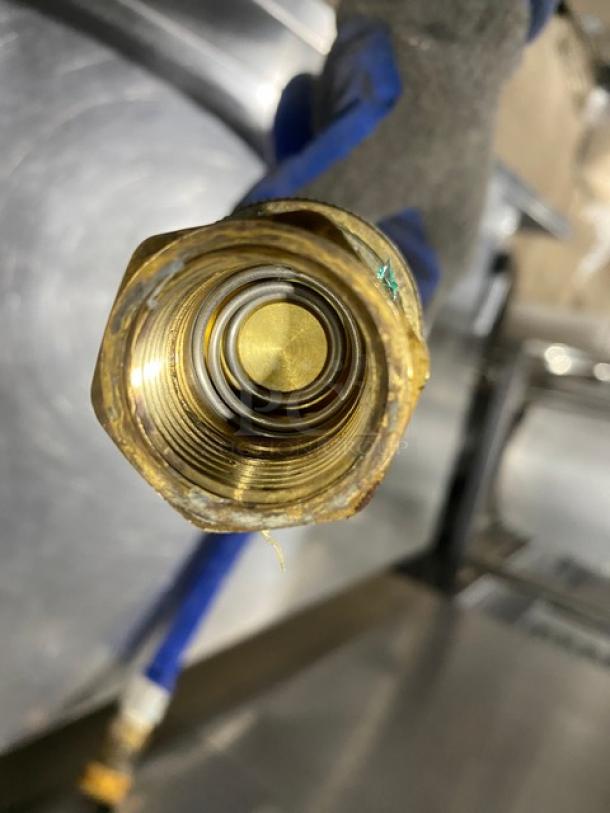 Commercial blue gas connector hose with brass fittings. Features a durable design. Suitable for high-pressure applications.