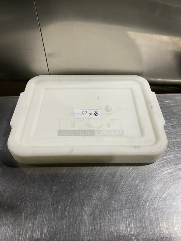 White rectangular food storage container with handled lid, viewed from above. Label reads "67 X." Item in good condition.