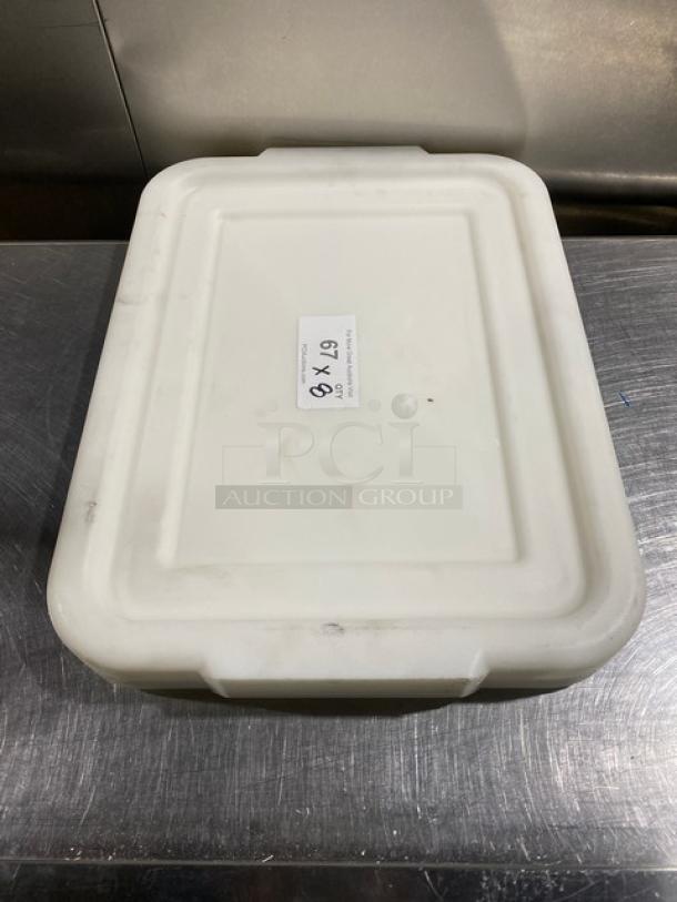 White rectangular food storage container with handled lid, lightly used. Label reads "8X Your Bid!" and size "67.9".