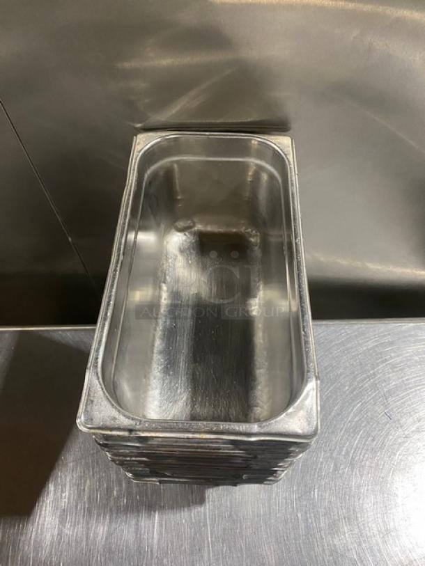 Commercial stainless steel hotel/steam table pan, rectangular, polished finish, stacked, 11x capacity, used condition.