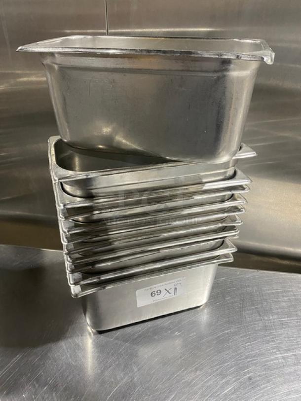 Stack of stainless steel hotel steamtable pans, used, 11 units, durable, ideal for commercial kitchens.