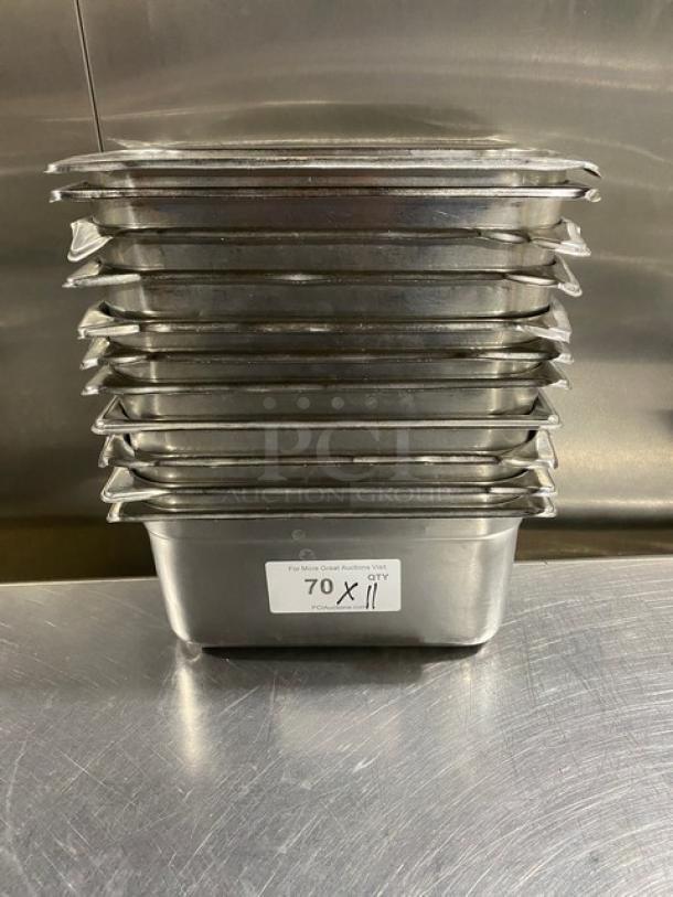Stack of 11 commercial stainless steel steam table pans, 11x7 inches each, steel label indicates "70 X 11 QTY." Excellent condition.