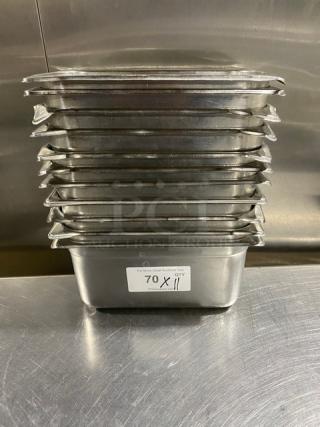 Stack of 11 commercial stainless steel steam table pans, 11x7 inches each, steel label indicates "70 X 11 QTY." Excellent condition.