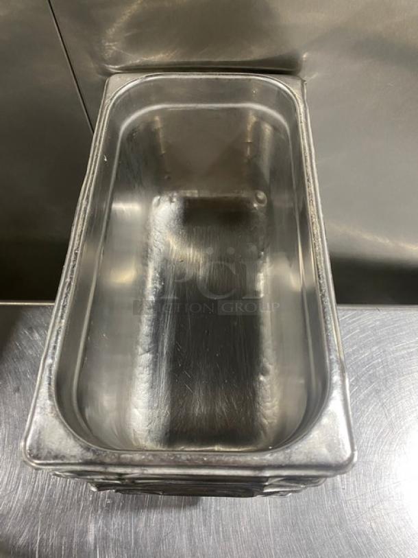Commercial stainless steel hotel pan, rectangular shape, used condition, 11x bid increase opportunity, no visible markings.