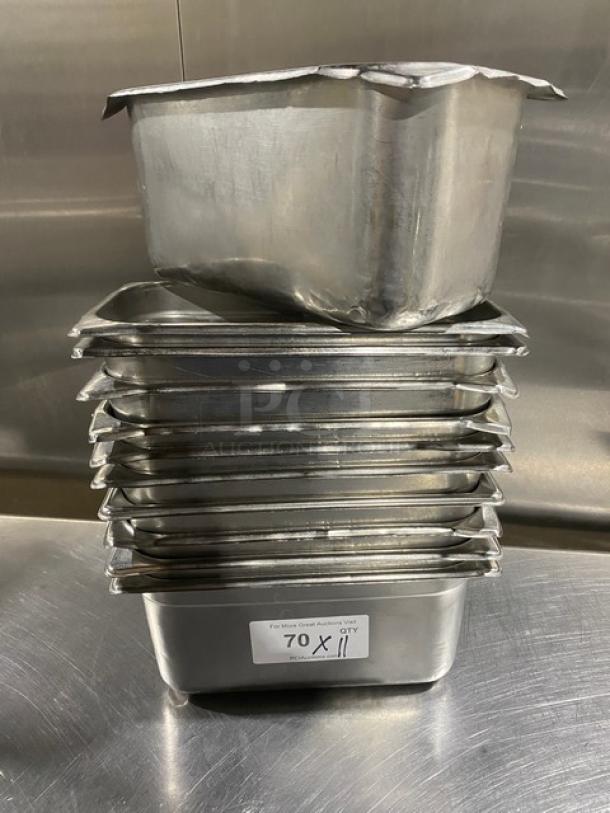 Stack of commercial stainless steel hotel steamtable pans, 11 available. Used condition, dimensions 11x. Label shows "70 X 11".