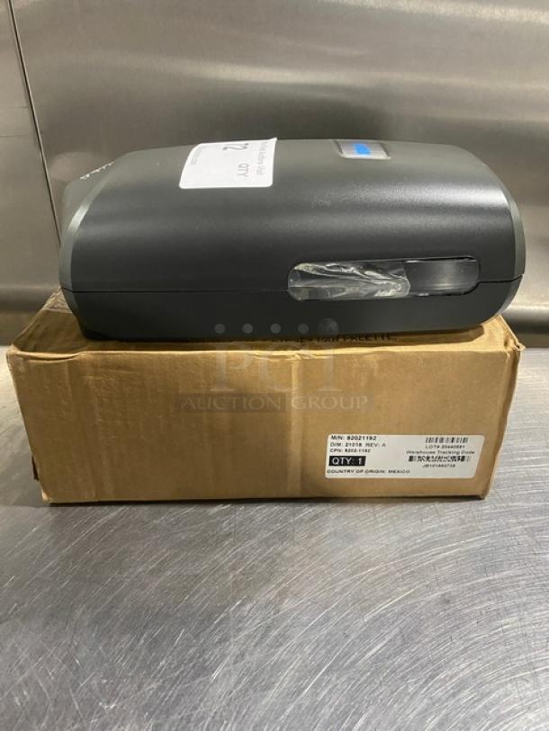 Ecolab Nexa Series commercial touch-free hand hygiene dispenser, new in box, includes branding and product labels.