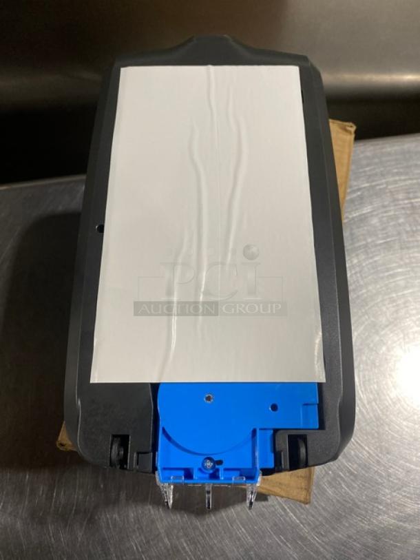 Ecolab Nexa Series touch-free hand hygiene dispenser, new in box, black casing with blue components, commercial use.