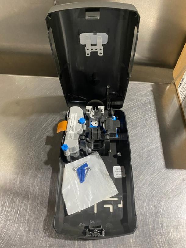 Ecolab Nexa Series touch-free hand hygiene dispenser, new condition, includes installation kit.