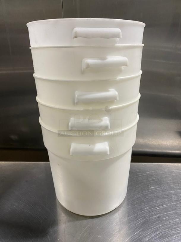 Commercial white round food storage containers with handles, stacked. Durable plastic, suitable for various uses.