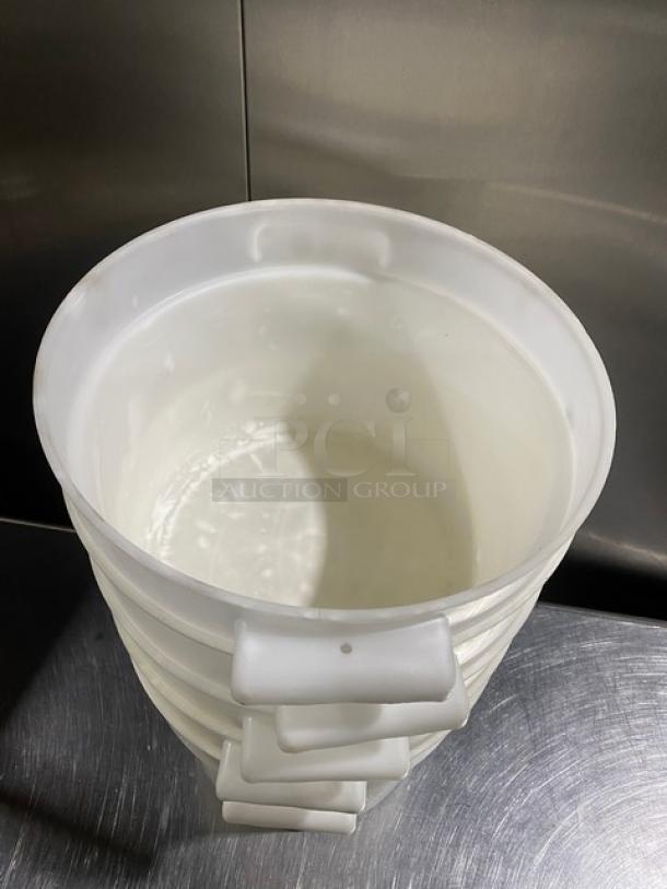 White round commercial food storage containers with handles, stacked. Ideal for bulk storage, clean and durable.