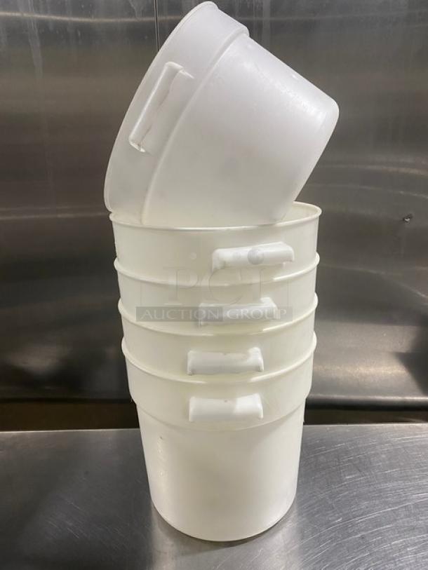 Stacked white round commercial food storage containers with handles, in good condition, set of five.