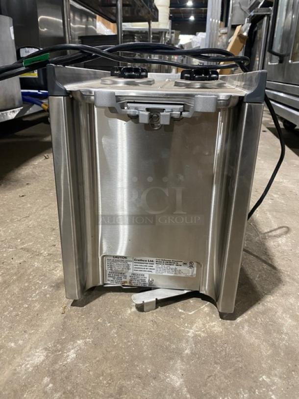 Crathco 2018 stainless steel countertop beverage dispenser, Model CS2E1D16, 120V, visible wiring, and manufacturer's label.