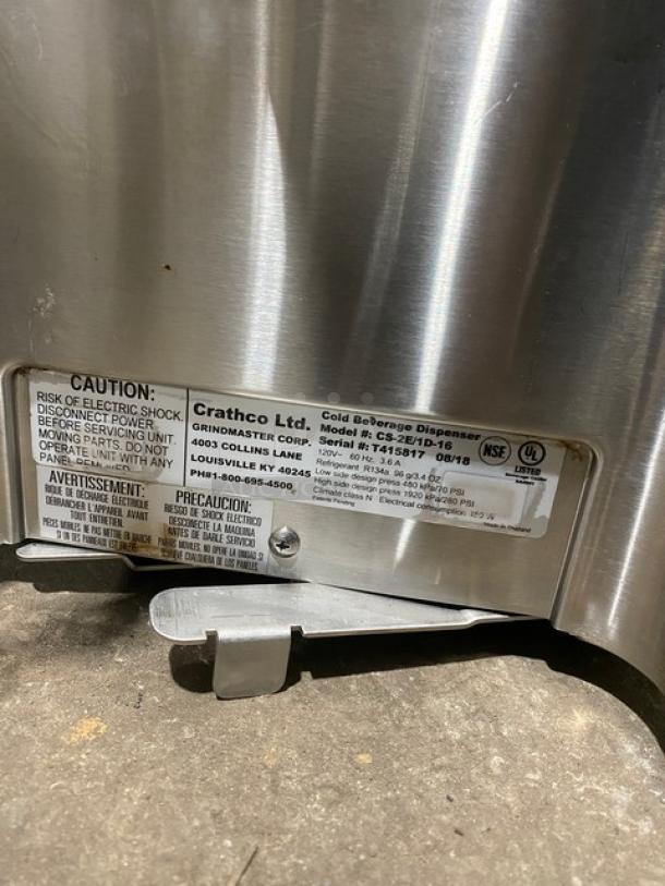 Crathco 2018 stainless steel beverage dispenser, Model CS2E1D16, SN: T415817. Features NSF certification label.