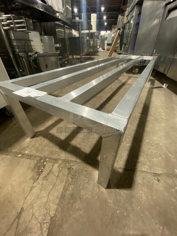 Commercial heavy-duty dunnage rack on legs, metal construction, sturdy for storage, industrial setting use, excellent condition.