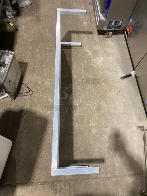 Commercial heavy-duty dunnage rack on legs, metal construction, used condition, ideal for storage and space-saving.