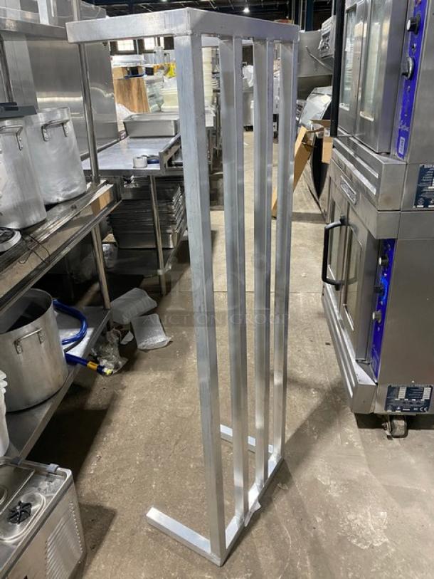 Commercial heavy-duty aluminum dunnage rack on legs in good condition, ideal for storing heavy items in kitchens or warehouses.