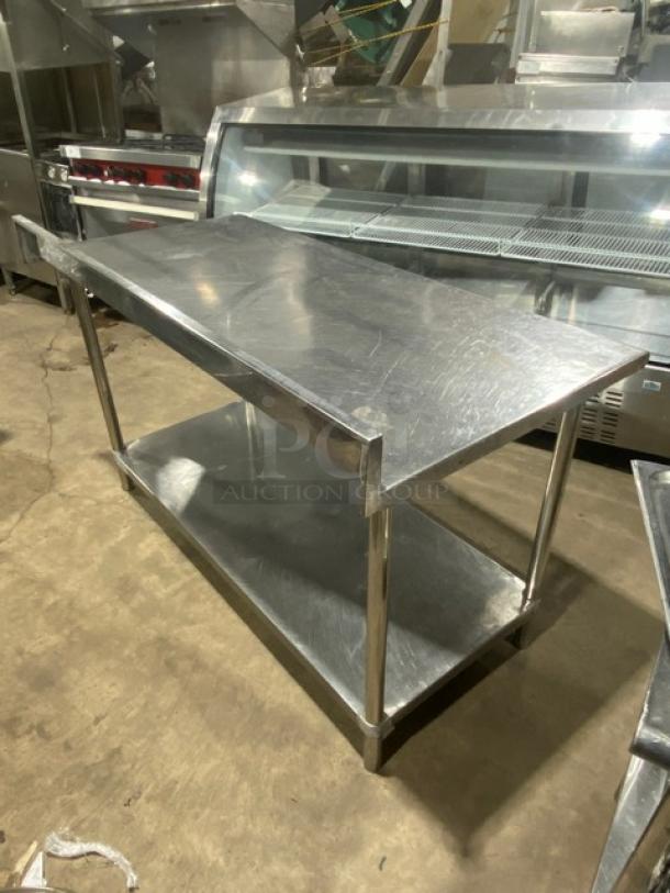 Commercial stainless steel worktop table with undershelf, upturned backsplash, on legs. Ideal for industrial kitchens.