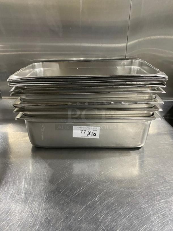 Stack of commercial stainless steel hotel steamtable pans. Includes 10 pans. Label reads "77, QTY X10." In excellent condition.