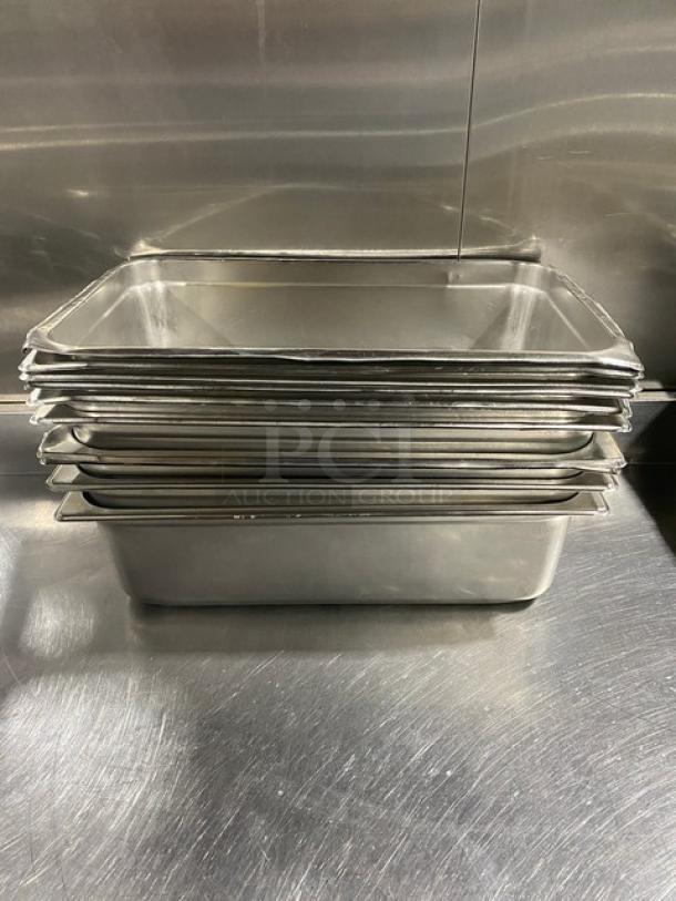 Stack of commercial stainless steel hotel/steamtable pans, excellent condition, ideal for catering or restaurant use.