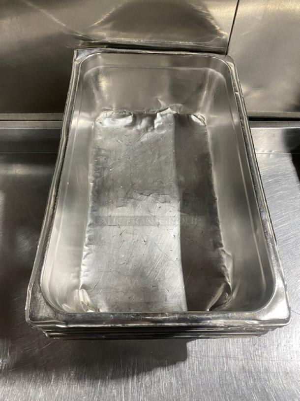 Commercial stainless steel hotel steamtable pan, in good condition, with stackable design and visible use marks.